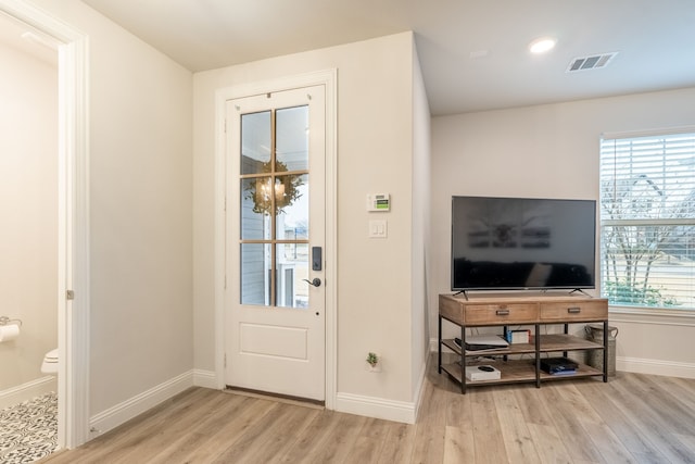 doorway to outside with light hardwood / wood-style flooring