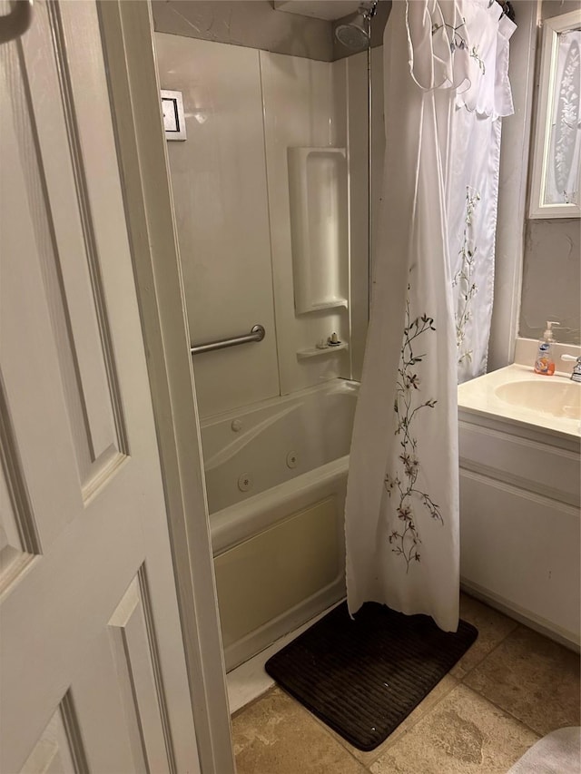 bathroom with shower / tub combo with curtain and vanity