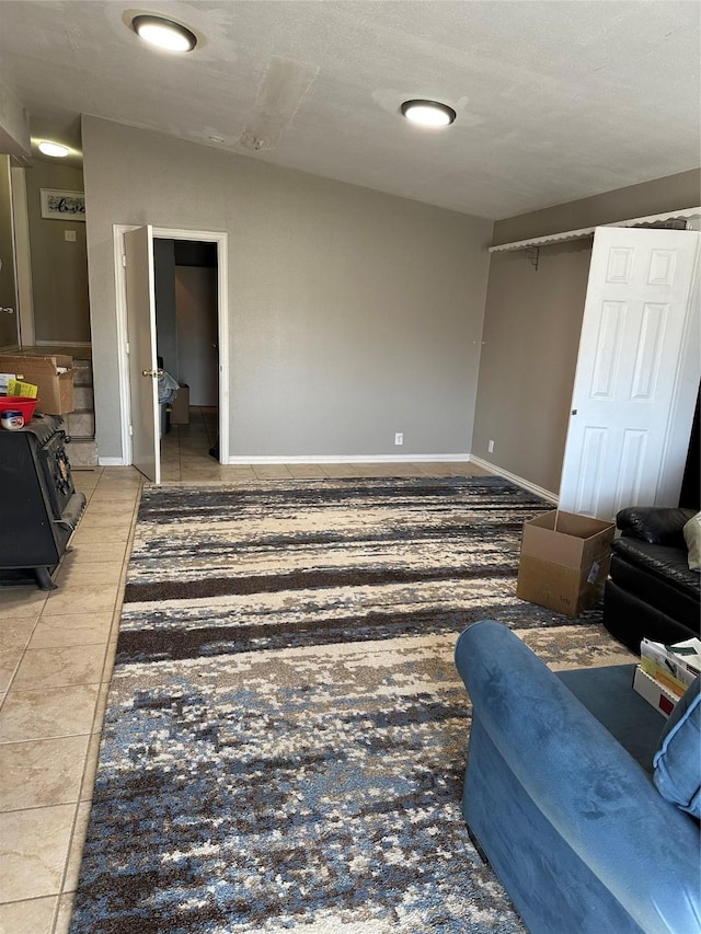 living room featuring tile patterned floors and baseboards