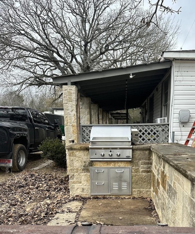 view of patio featuring area for grilling and a grill