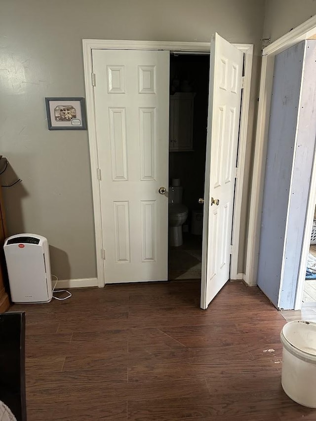 hall featuring dark wood-style flooring
