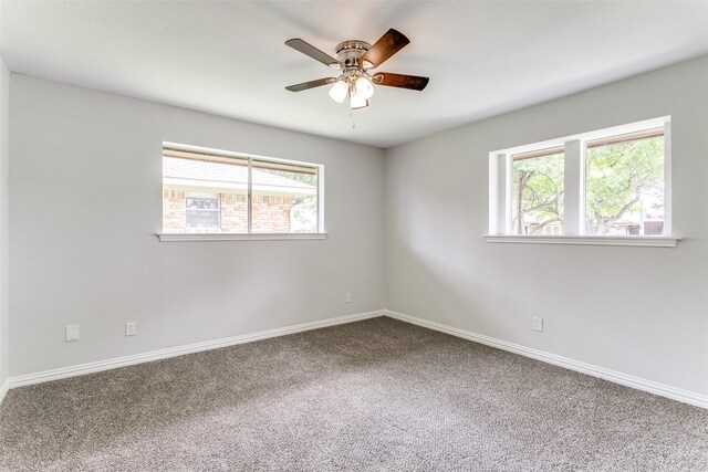 2261 Woodcreek, Carrollton, TX 75006 - carpeted empty room with ceiling fan