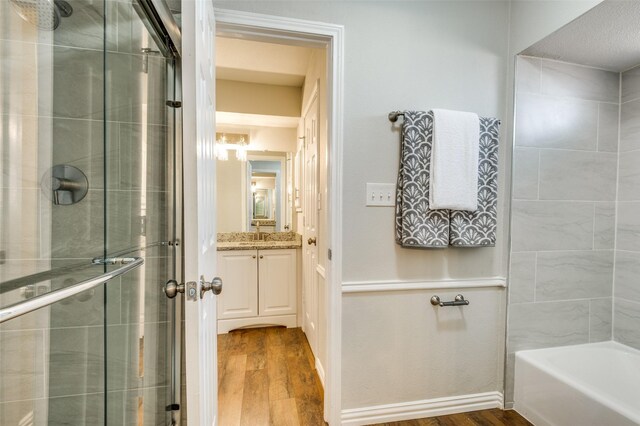 2261 Woodcreek, Carrollton, TX 75006 - bathroom with vanity and hardwood / wood-style floors