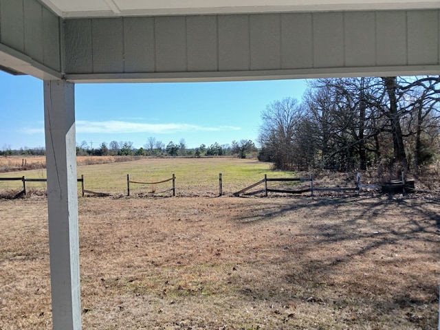 view of yard with a rural view