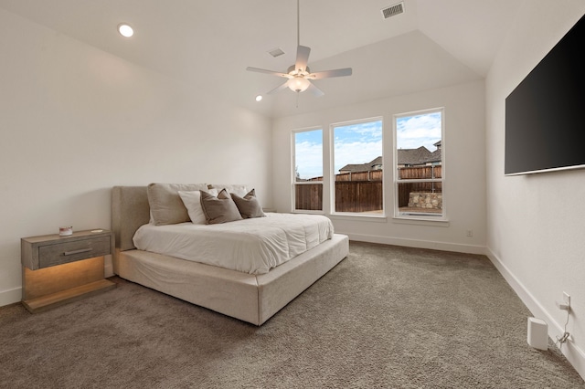 carpeted bedroom featuring vaulted ceiling and ceiling fan