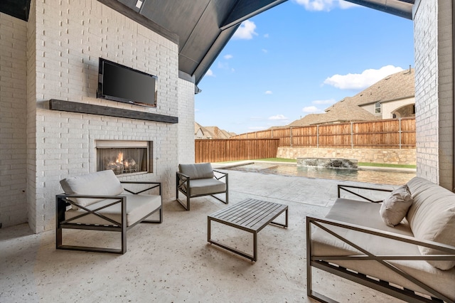 view of patio / terrace featuring an outdoor living space with a fireplace