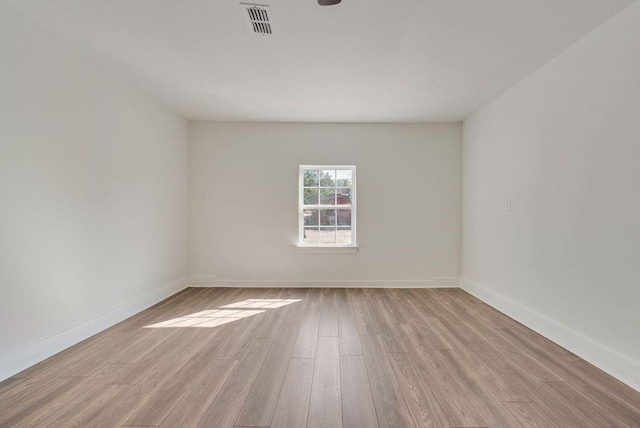 spare room with light wood-type flooring