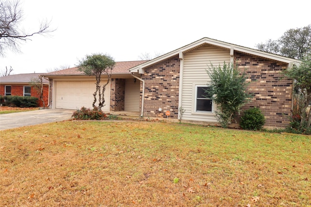 ranch-style home featuring a garage and a front yard