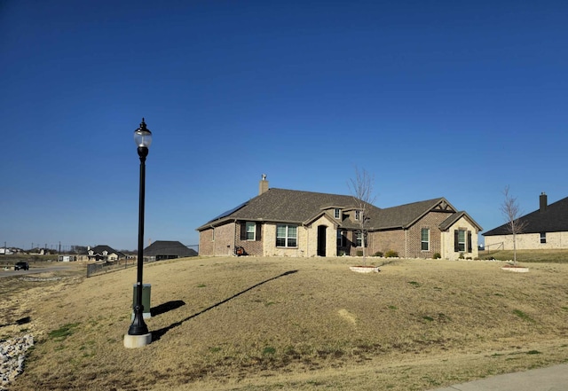 french country inspired facade featuring brick siding