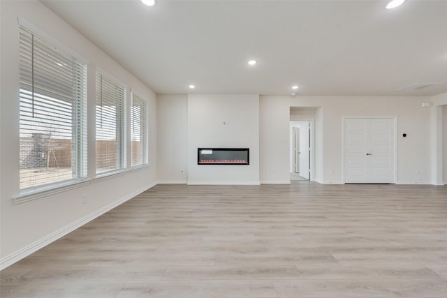 unfurnished living room featuring light hardwood / wood-style floors