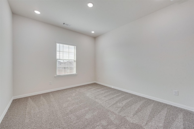 unfurnished room with carpet floors