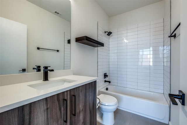 bathroom featuring toilet, tile patterned floors, washtub / shower combination, and vanity