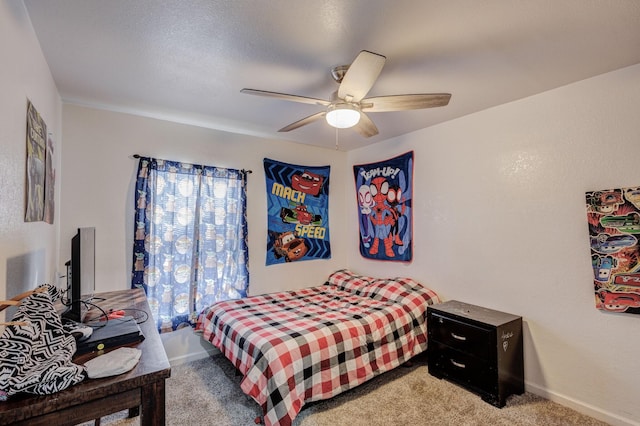 bedroom with ceiling fan and carpet flooring