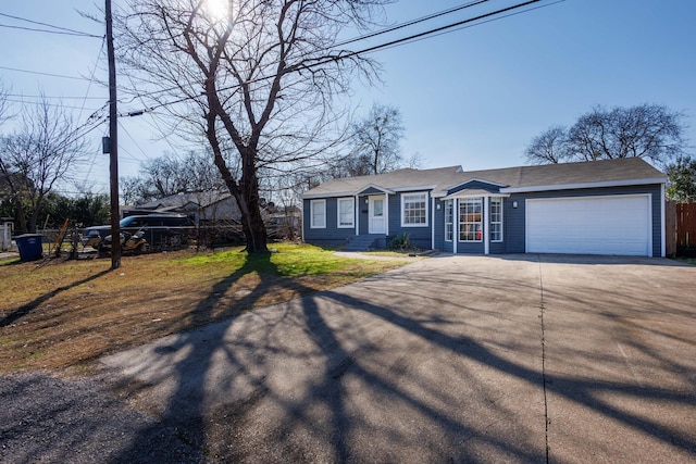 single story home featuring a garage