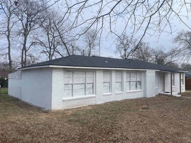 view of property exterior with a yard