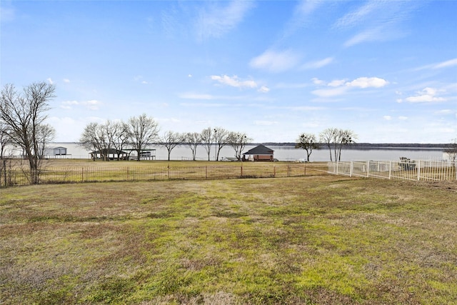 view of yard featuring a gazebo, a water view, and a rural view