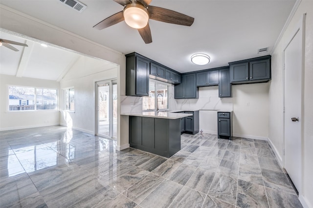 kitchen featuring gray cabinetry, ceiling fan, sink, and vaulted ceiling with beams