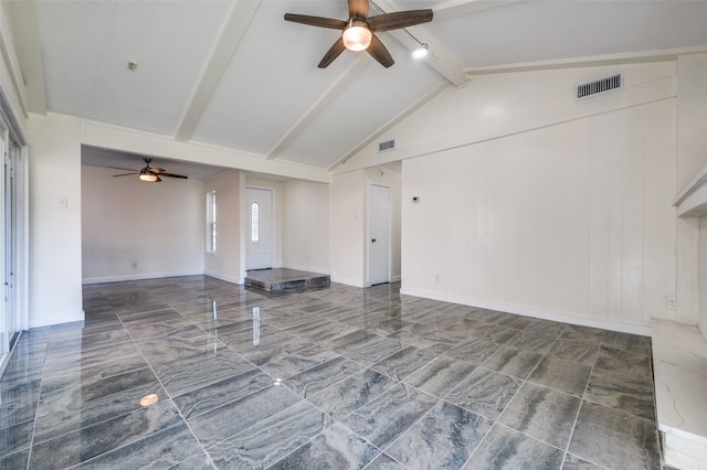 unfurnished living room featuring ceiling fan and lofted ceiling with beams