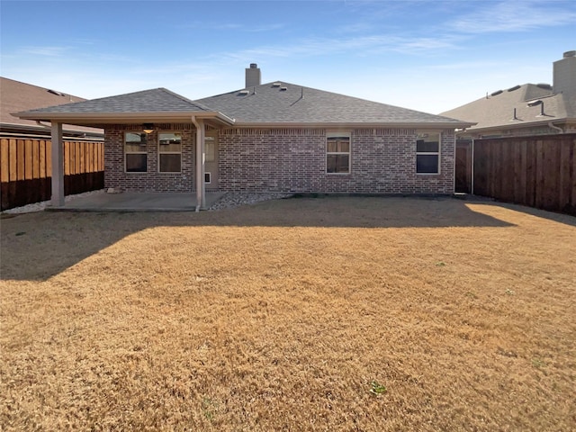 rear view of property featuring a patio area