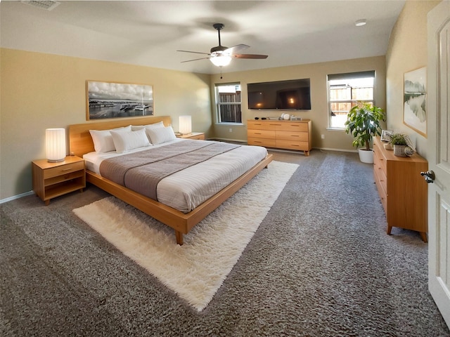 bedroom featuring ceiling fan and dark colored carpet