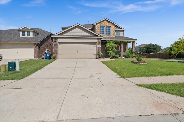 craftsman-style house featuring a garage and a front lawn