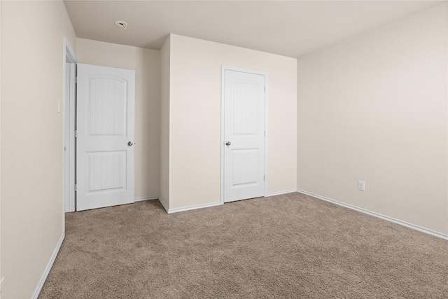 unfurnished bedroom with carpet