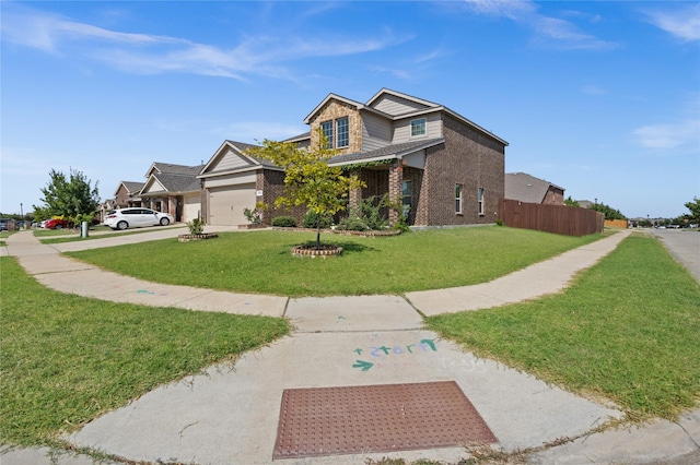 view of front of home featuring a garage and a front yard