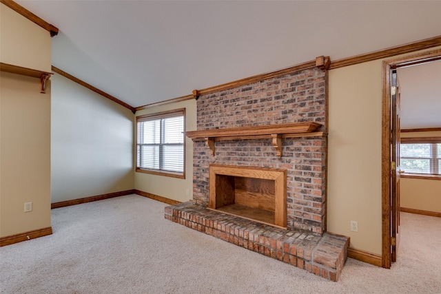 unfurnished living room featuring light carpet, crown molding, vaulted ceiling, and a healthy amount of sunlight