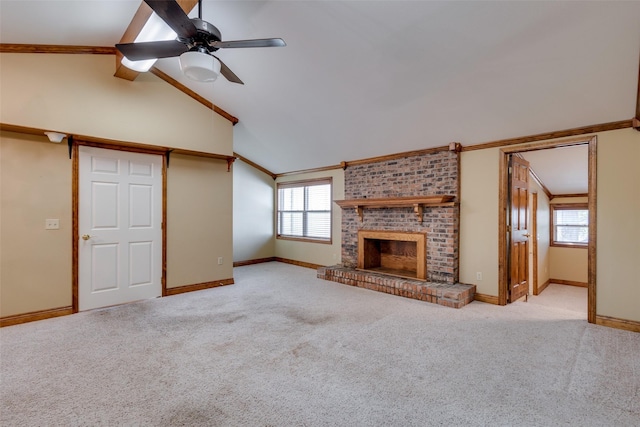 unfurnished living room featuring ornamental molding, lofted ceiling, light carpet, and a brick fireplace