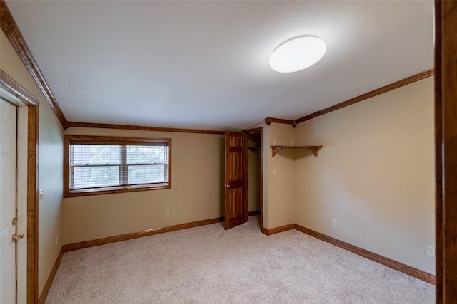 unfurnished bedroom with crown molding and light colored carpet