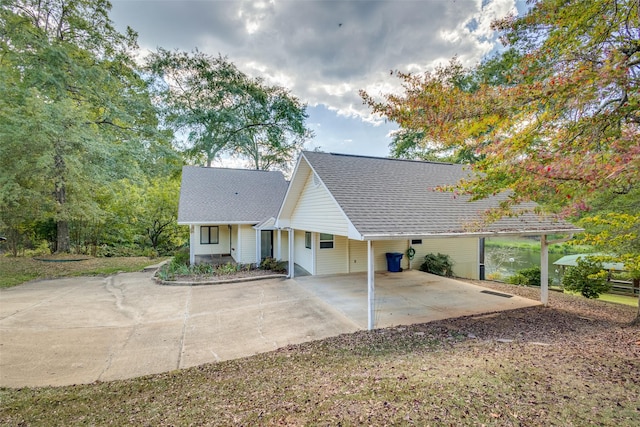 back of property featuring a carport