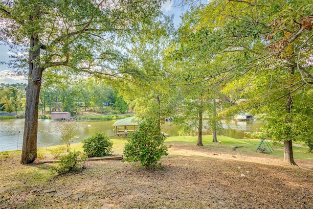 view of yard featuring a gazebo and a water view