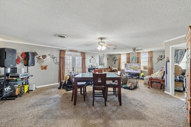 dining room with carpet floors, french doors, visible vents, ornamental molding, and baseboards