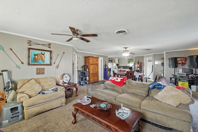 living room featuring ornamental molding, carpet, and visible vents