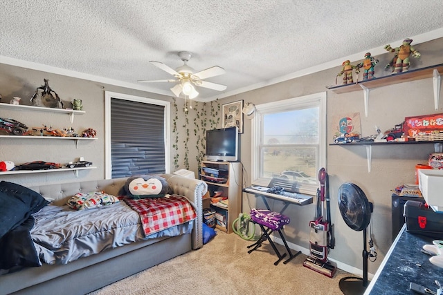 carpeted bedroom featuring a textured ceiling, a ceiling fan, and baseboards