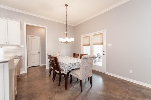 dining area with crown molding and a chandelier