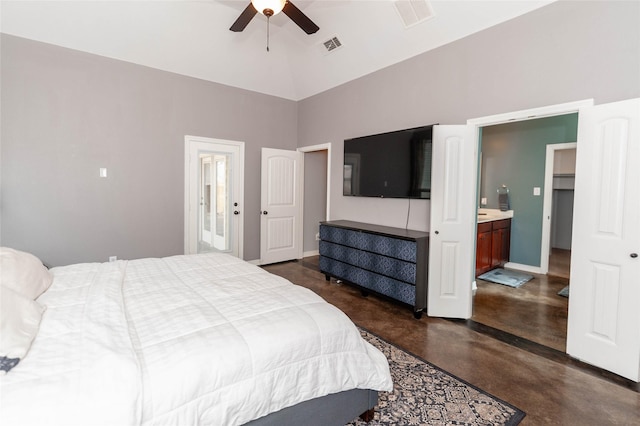 bedroom featuring ensuite bathroom, vaulted ceiling, and ceiling fan