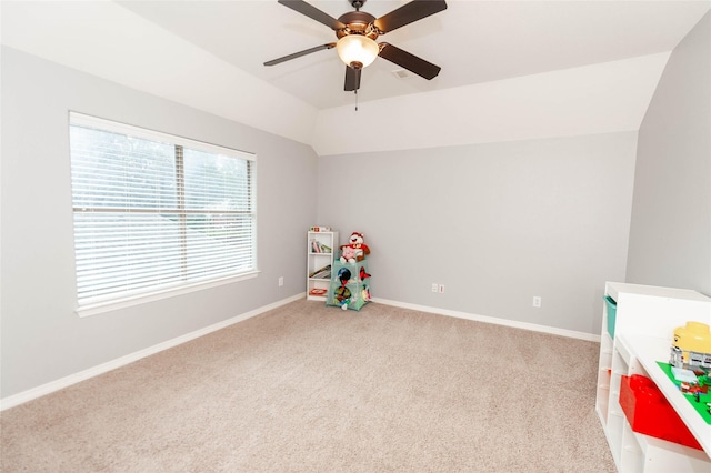 playroom with light carpet, vaulted ceiling, and ceiling fan