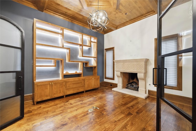 interior space with crown molding, wooden ceiling, and light hardwood / wood-style floors