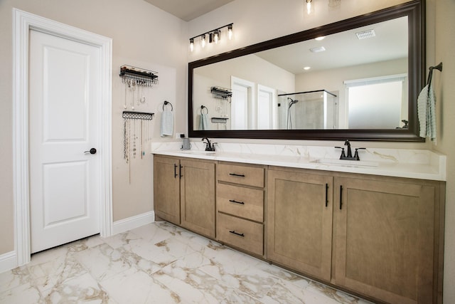 bathroom featuring vanity and an enclosed shower