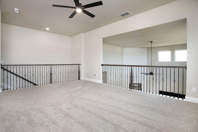 carpeted empty room with ceiling fan