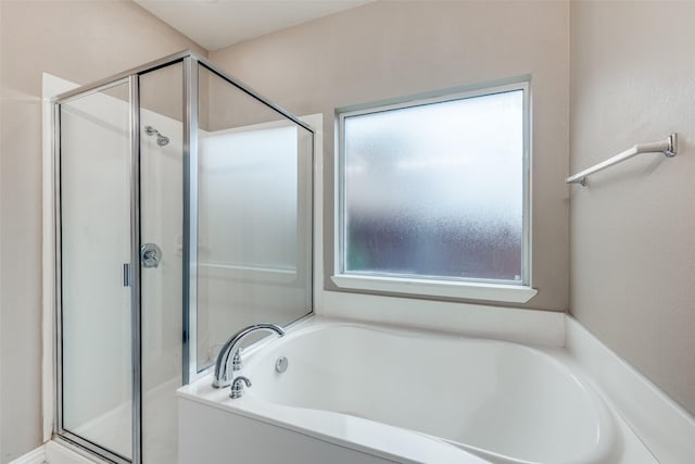 bathroom with separate shower and tub