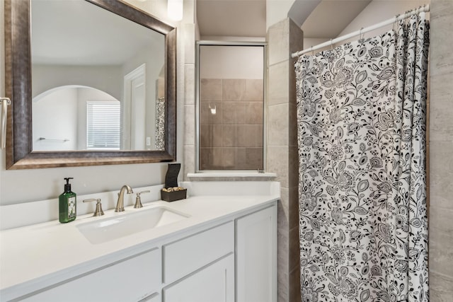 bathroom with vanity and curtained shower