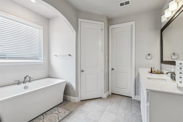 bathroom with vanity and a bathing tub