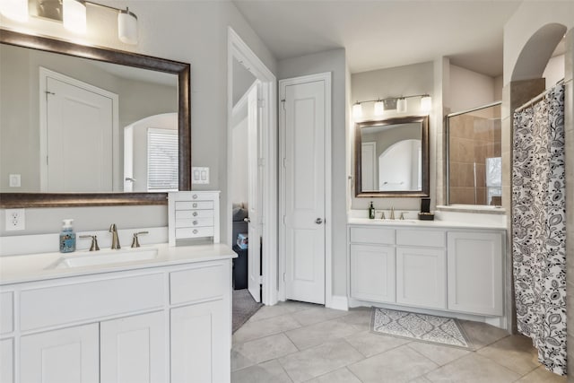 bathroom featuring tile patterned flooring, vanity, and a shower with curtain