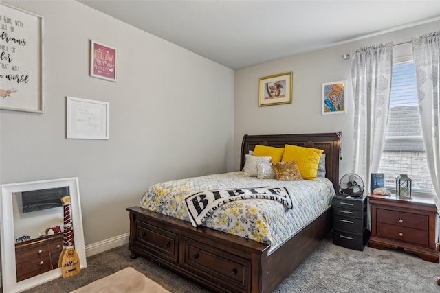 carpeted bedroom with multiple windows