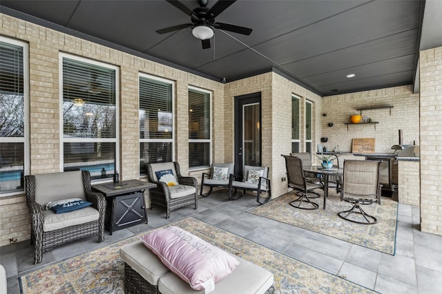 view of patio / terrace with ceiling fan and an outdoor living space