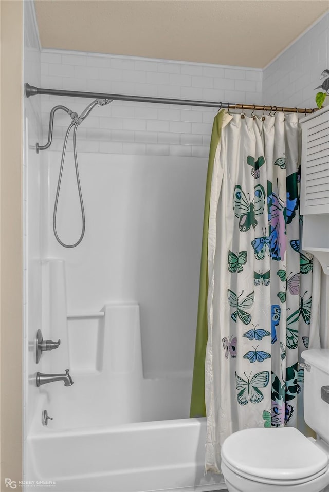 bathroom with shower / tub combo with curtain and toilet