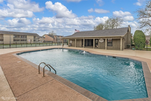 view of swimming pool with a patio area