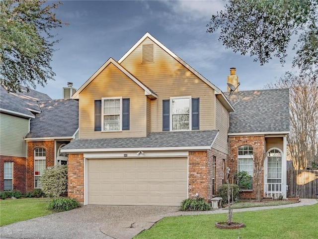 traditional home featuring a garage, brick siding, concrete driveway, a front lawn, and a chimney